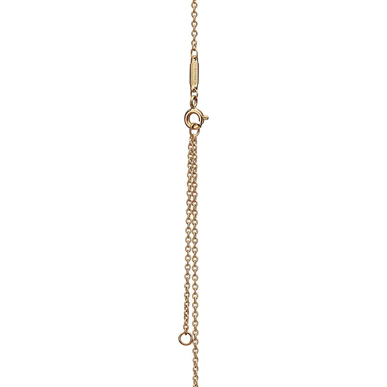 T*f*ny knot pendant in yellow gold with diamonds