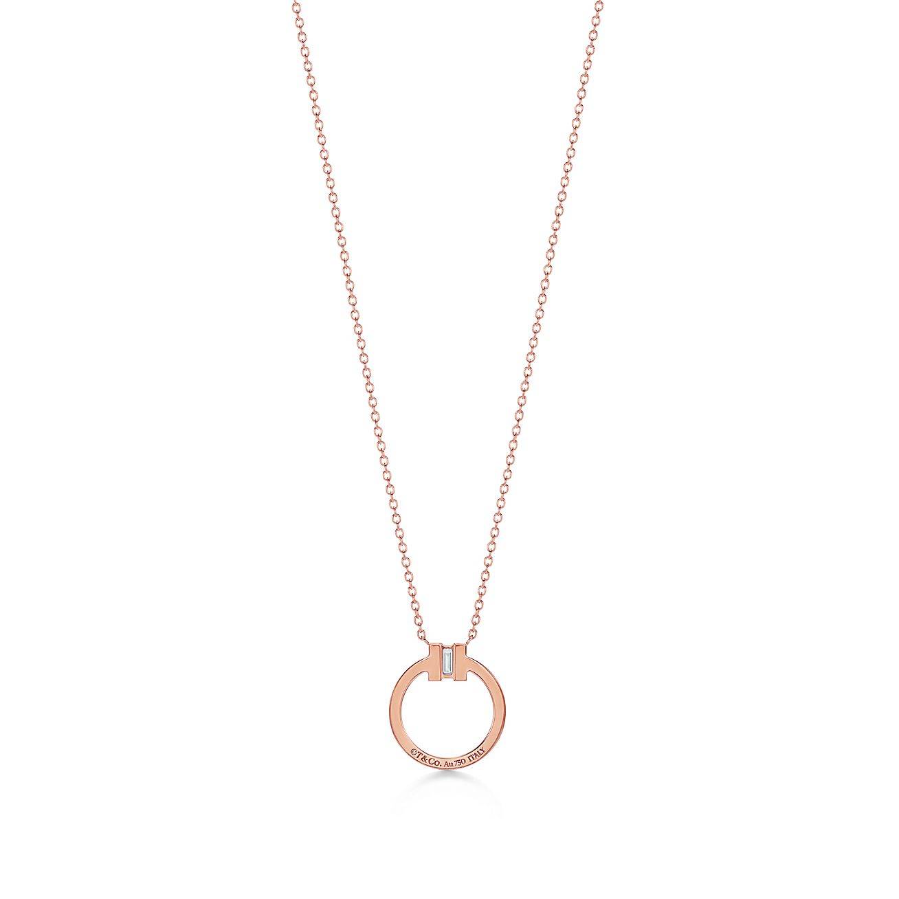 T*f*ny t diamond pendant in 18k rose gold with a baguette diamond