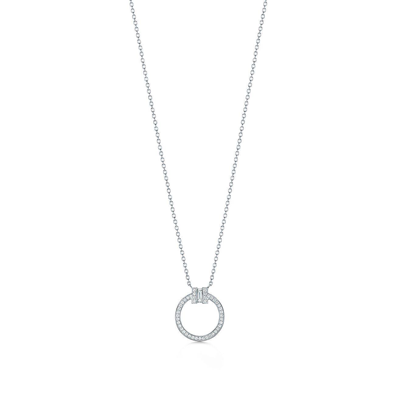 T*f*ny t diamond pendant in 18k white gold with a baguette diamond