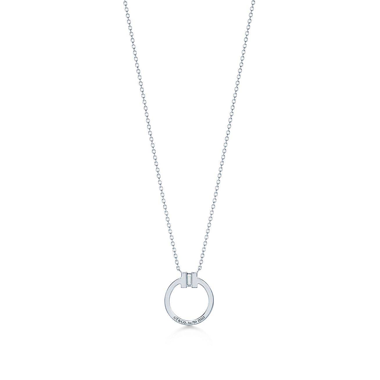 T*f*ny t diamond pendant in 18k white gold with a baguette diamond