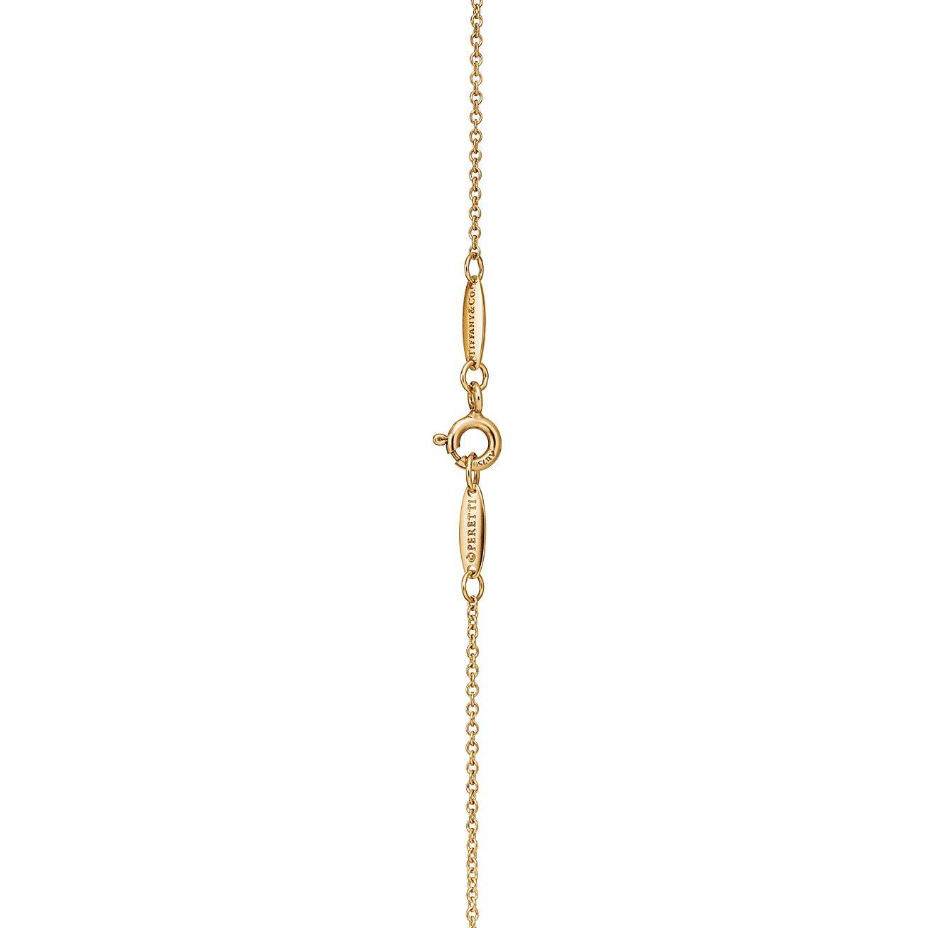 T*f*ny  elsa peretti® open heart pendant in 18k gold with diamonds