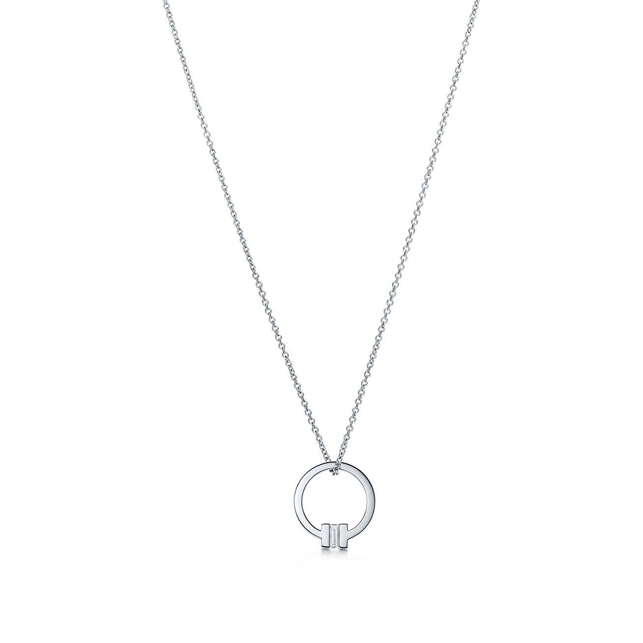 T*f*ny t pendant in 18k white gold with a baguette diamond